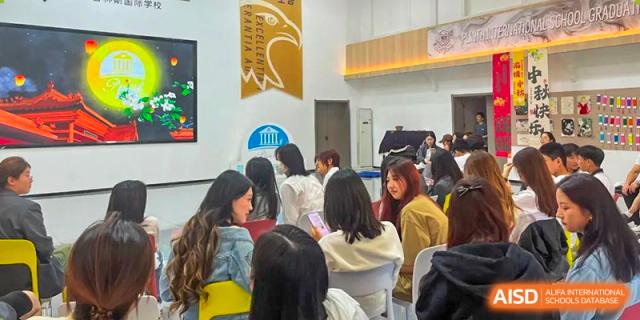 Students attending a classroom or assembly event at Shanxi Plinth International School.