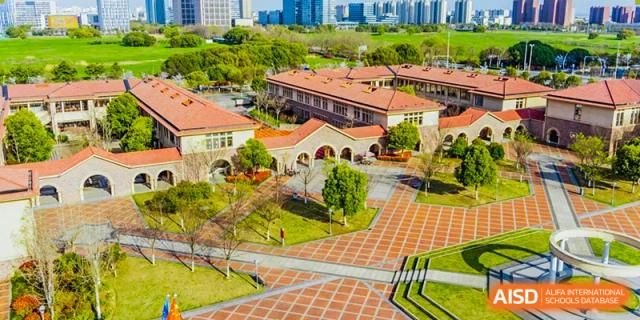 Aerial view of the brick buildings and campus courtyard at Wuxi Boston International School.