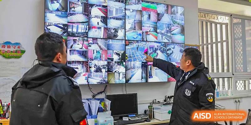 A security room filled with monitors for CCTV surveillance on the campus of Wuhan Britain-China School.