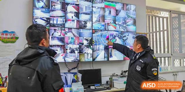 A security room filled with monitors for CCTV surveillance on the campus of Wuhan Britain-China School.