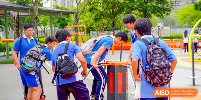 Students participating in an outdoor team-building activity or game at Shenzhen Third Senior High School International Division A-Level Class.