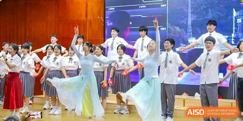 Students performing a graceful dance in light-colored traditional outfits at Shenzhen Third Senior High School International Division A-Level Class.