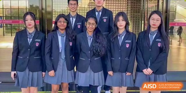 A group of female students in their school uniforms, consisting of blazers and pleated skirts, at Alcanta International College.