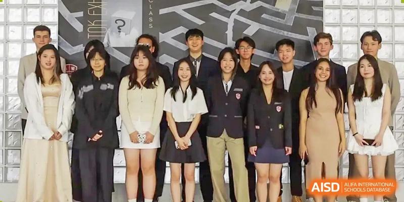 A group of students and teachers posing for a group photo at an event at Alcanta International College.