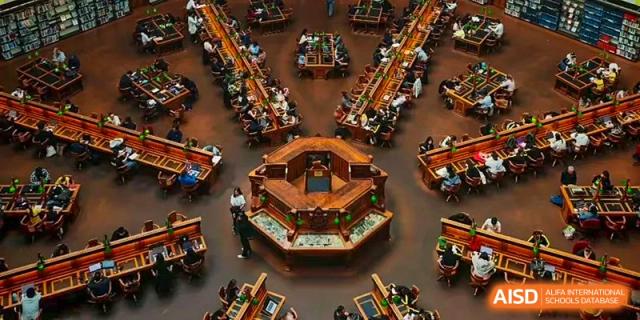 An aerial view of an elaborate, traditional-style model or wooden structure used for display or study at CHONGQING WEIMING SCHOOL.
