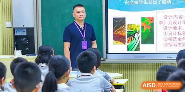A teacher at CHONGQING WEIMING SCHOOL instructing a group of students in a classroom setting.