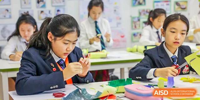 A student from Dulwich College Shanghai Puxi creating art in a classroom.