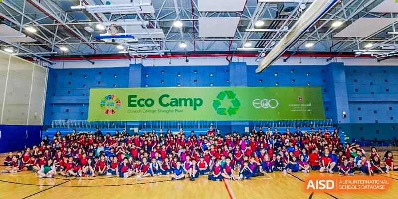 Students from Dulwich College Shanghai Puxi posing for a group photo at an "Eco Camp" event.