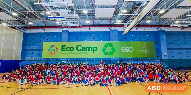 Students from Dulwich College Shanghai Puxi posing for a group photo at an "Eco Camp" event.