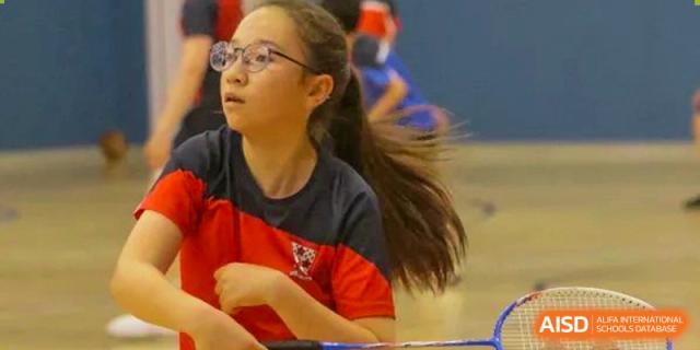 A student from Dulwich College Shanghai Puxi playing basketball.
