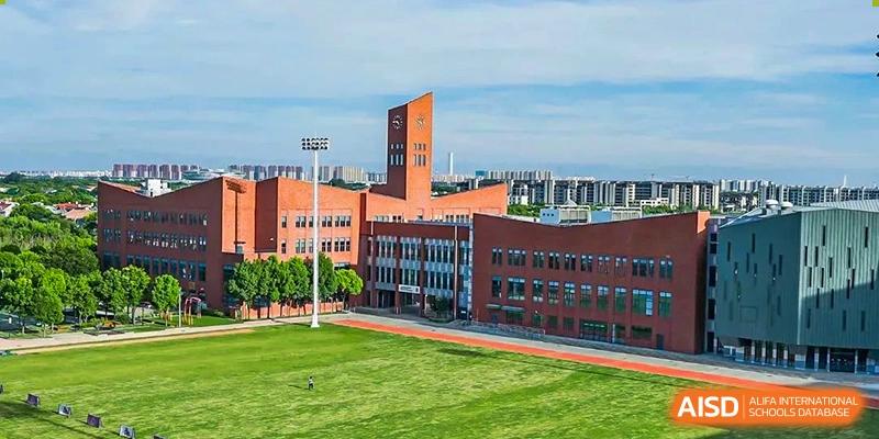 An aerial view of the campus and sports field at Dulwich College Shanghai Puxi.