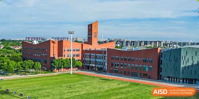 An aerial view of the campus and sports field at Dulwich College Shanghai Puxi.