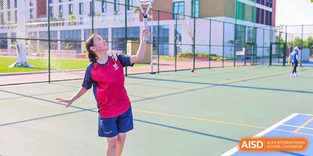 A student from Dulwich College Shanghai Puxi playing badminton.