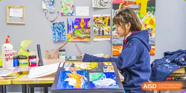 Students from Dulwich International Suzhou High School Programme collaborating on an art project.