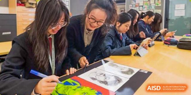 A female student from Dulwich International Suzhou High School Programme working on an art project.