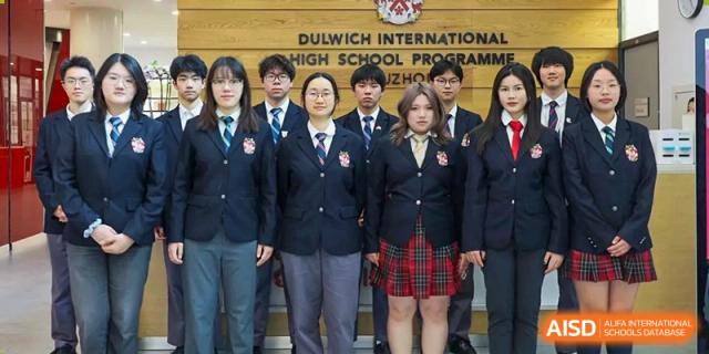 A group of students from Dulwich International Suzhou High School Programme posing for a formal school photo.