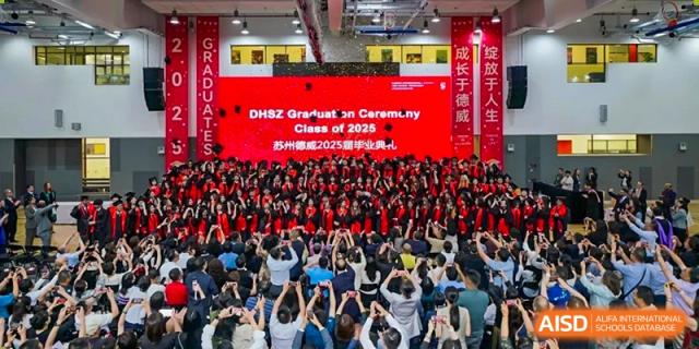 A large crowd of students from Dulwich International Suzhou High School Programme attending a graduation ceremony.