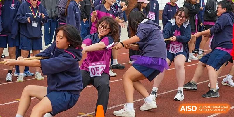 Students from Dulwich International Suzhou High School Programme competing in a tug-of-war game.