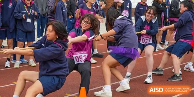 Students from Dulwich International Suzhou High School Programme competing in a tug-of-war game.