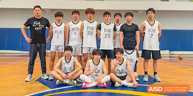 A group photo of the boys' basketball team in their jerseys at Fuzhou Lakeside International School.