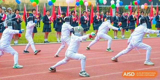 A student at HAILIANG FOREIGN LANGUAGE SCHOOL practices fencing on a running track.