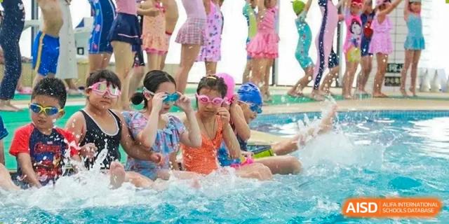 Students from HAILIANG FOREIGN LANGUAGE SCHOOL play in a swimming pool during a class.