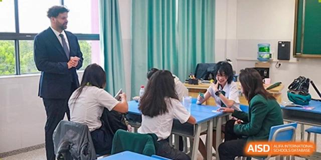 A student taking notes during a class at Kunming World Youth Academy.