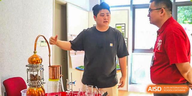 A teacher from Sanya Haiya  Foreign Language School instructing a class in a science laboratory.