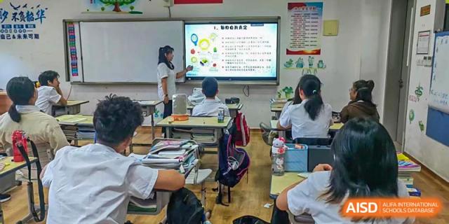 A classroom full of students from Sanya Haiya  Foreign Language School sitting at their desks.
