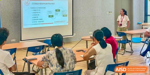 Students from Sanya Haiya  Foreign Language School paying attention to a presentation with a projector.