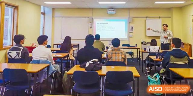 Students from Sanya Haiya  Foreign Language School attending a class with a smart board.