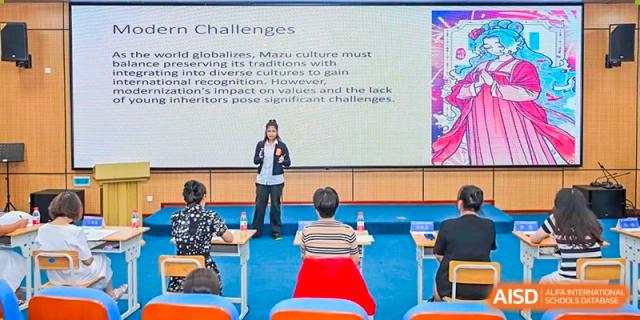 A teacher from Sanya Haiya  Foreign Language School giving a presentation in a classroom.
