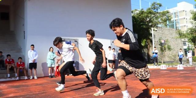 Students from Sanya Haiya  Foreign Language School doing a running drill with an instructor.