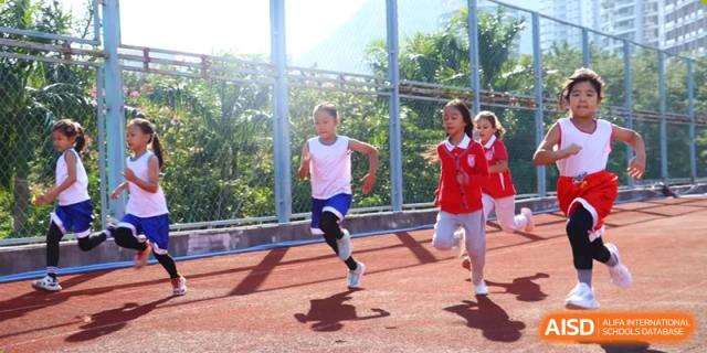 Sanya Haiya  Foreign Language School students running a race on a track.