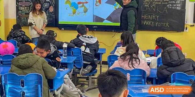 Students from Shanghai Qibao Dwight High School use virtual reality headsets in a classroom setting.
