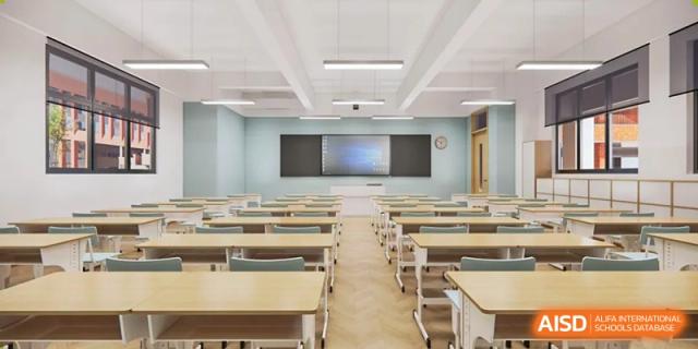 An empty, tidy classroom with rows of desks and chairs facing a whiteboard at Sino-Canada School.