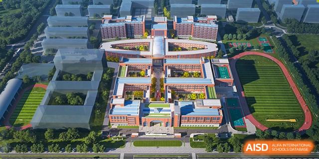 An aerial view of a large, modern campus with multiple buildings and courtyards at Sino-Canada School.