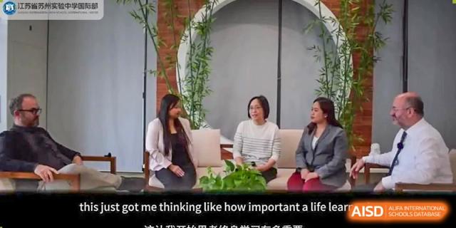 Students from Suzhou Experimental High School International Center sit on a couch during an interview.