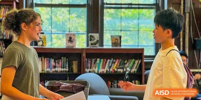 A close-up shot of a library bookshelf with books at The MacDuffie School Tianjin.