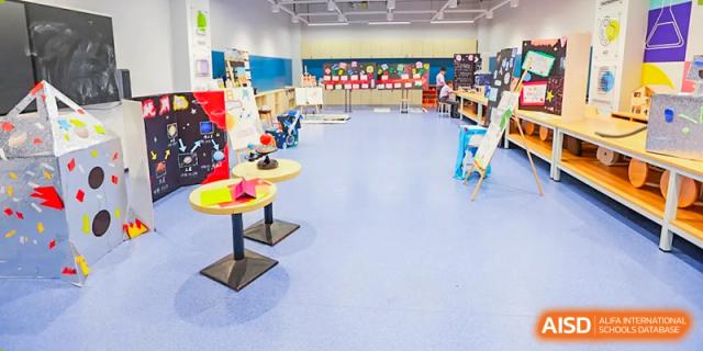 A colorful and open classroom with small tables and chairs. Guangzhou International Primary/Middle School Huangpu