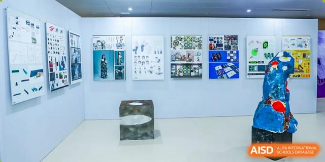 A modern classroom with whiteboards and shelves containing technology. Guangzhou International Primary/Middle School Huangpu