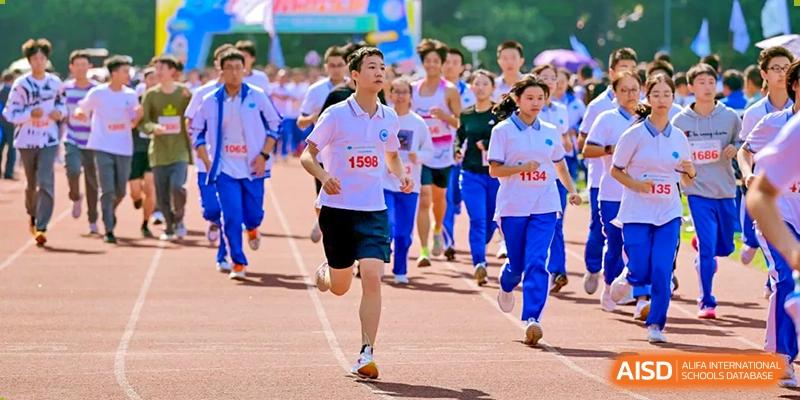 Chengdu No.7 High School International Department student running in a race with a group of other participants during a sports day event.