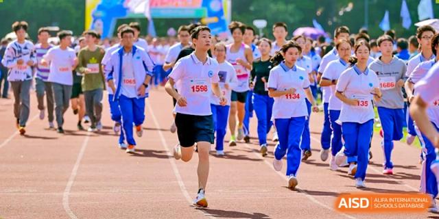 Chengdu No.7 High School International Department student running in a race with a group of other participants during a sports day event.