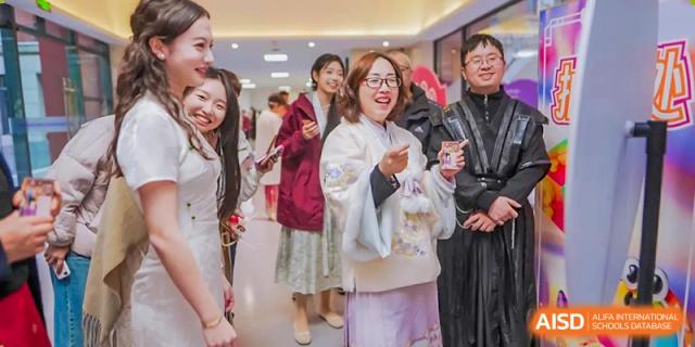 Chengdu No.7 High School International Department teacher or staff member smiling while attending an event in traditional Chinese clothing.