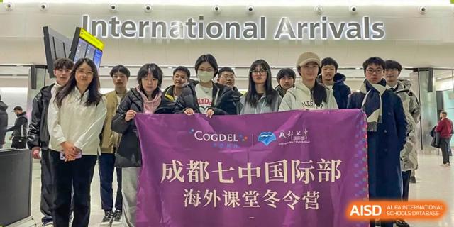 Group of Chengdu No.7 High School International Department students holding a banner for an international winter camp or study abroad program.