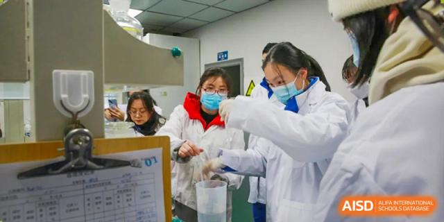 Chengdu Shishi High School Cambridge A-Level Centre students working together in a science lab.