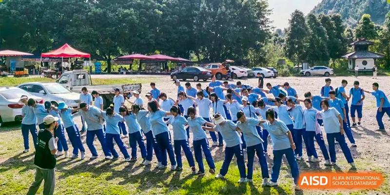 Chengdu Shishi High School Cambridge A-Level Centre students participating in a tug-of--war.