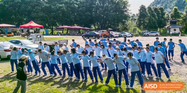Chengdu Shishi High School Cambridge A-Level Centre students participating in a tug-of--war.