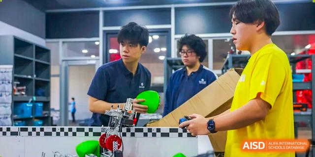 Concordia International School Shanghai students working together on building a robot for a competition.