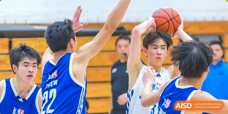 Concordia International School Shanghai students competing for the ball during a high-energy basketball game.